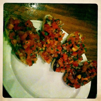 Bruschetta - Toasted Italian bread topped with fresh tomato, basil, red onion, garlic and olive oil (AU$12)
